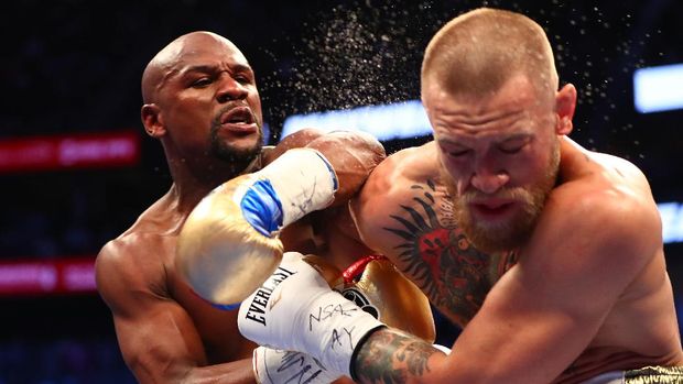 Mayweather Jr pernah mengalahkan Conor McGregor dalam pertarungan tinju. (