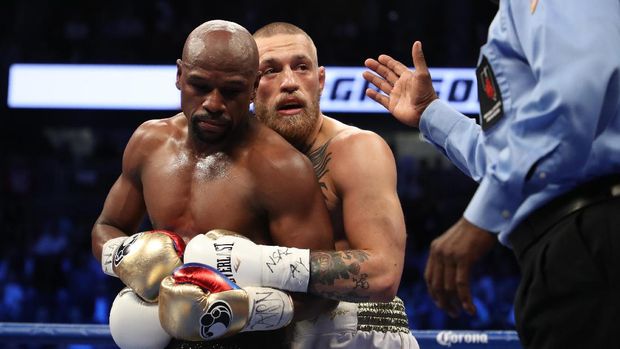 Conor McGregor menantang Floyd Mayweather Jr. bertarung di arena UFC.