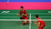 Tontowi/Liliyana merayakan kemenangan. Reuters/Russell Cheyne.