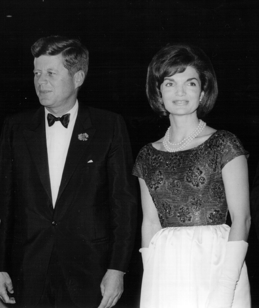 Jackie Kennedy 381091 52: President John F. Kennedy speaks during a press conference as First Lady Jackie Kennedy looks on April 9, 1963 at the White House House. (Photo by National Archive/Newsmakers)