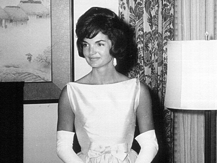 Jackie Kennedy 381091 52: President John F. Kennedy speaks during a press conference as First Lady Jackie Kennedy looks on April 9, 1963 at the White House House. (Photo by National Archive/Newsmakers)