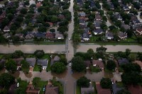 Rescue crews are seen with boats near flood waters brought by Tropical Storm Harvey in West Houston, Texas, U.S. August 30, 2017. Picture taken August 30, 2017. REUTERS/Adrees Latif