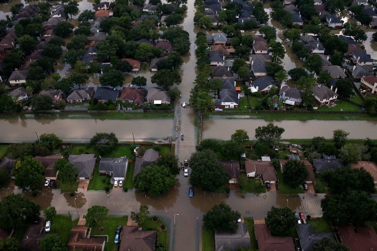 Rescue crews are seen with boats near flood waters brought by Tropical Storm Harvey in West Houston, Texas, U.S. August 30, 2017. Picture taken August 30, 2017. REUTERS/Adrees Latif