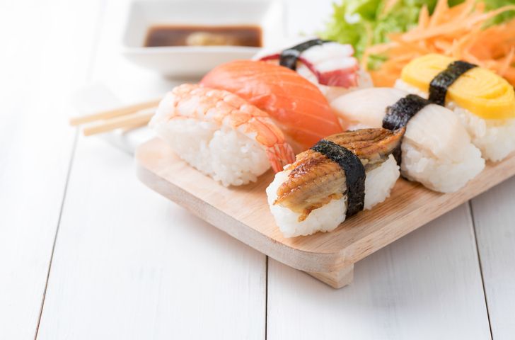 sushi with sauce and wasabi on old white wood plate, Japanese food