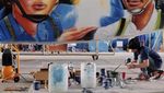 Begini Proses Mural Warkop DKI Reborn di Pesawat