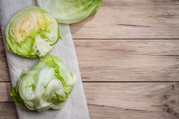 Iceberg lettuce on wooden table