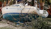 Perahu yang rusak naik ke darat di Coconut Grove di Florida. 10 September 2017. (REUTERS/Carlo Allegri)