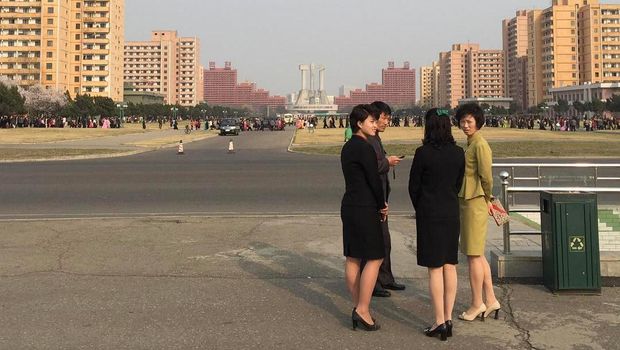PYONGYANG, NORTH KOREA - APRIL 02: People look out the window of a bus on April 2, 2011 in Pyongyang, North Korea. Pyongyang is the capital city of North Korea and the population is about 2,500,000.  (Photo by Feng Li/Getty Images)