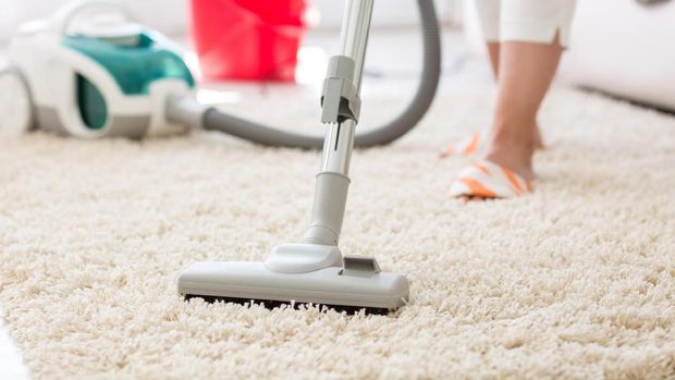 Suction grey carpet cleaning with vacuum cleaner
