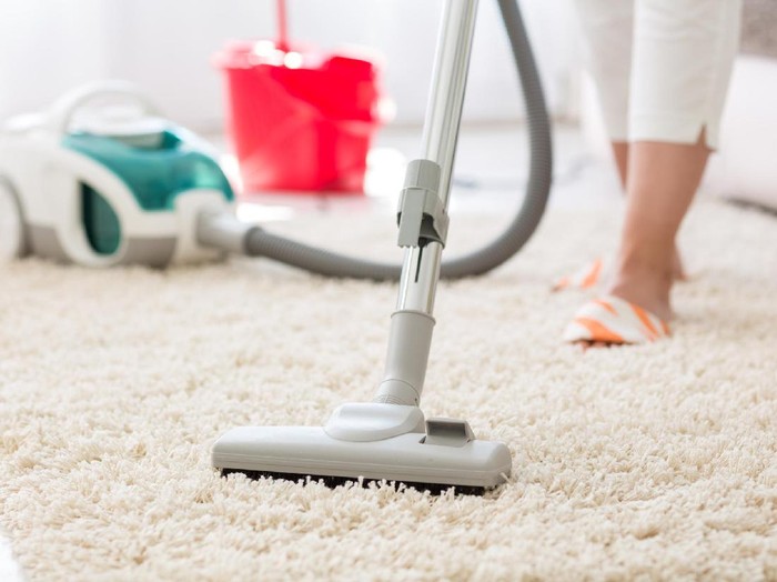 Suction grey carpet cleaning with vacuum cleaner