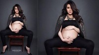 Olla Ramlan tampak menunjukkan perut besarnya yang hanya mengenakan atasan pendek berwarna hitam. Dok. Instagram/dierabachir
