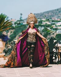 Agnez Mo memakai rancangan Anne Avantie di video klip 'As Long As I Get Paid'.