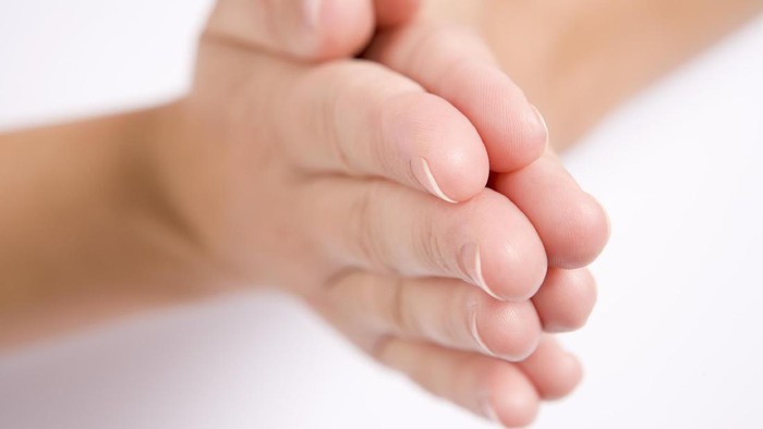 Womans hands together in prayer