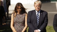 Trump menyampaikan rasa bela sungkawa didampingi Melania Trump. REUTERS/Kevin Lamarque.