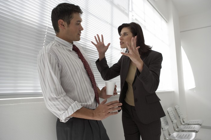 Depressed woman pressing her hand against her forehead