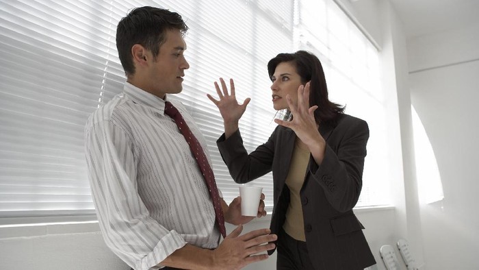 Depressed woman pressing her hand against her forehead