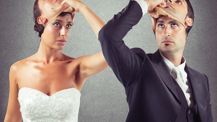Business man carrying white mask to his body indicating Business fraud and faking business partnership