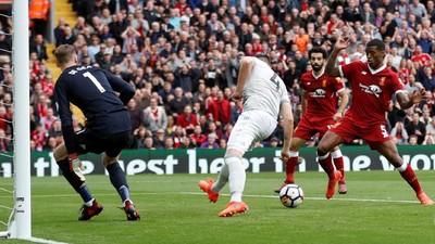 Setan Merah Redam Si Merah di Anfield