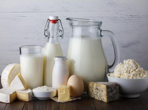 Dairy products on wooden table still life