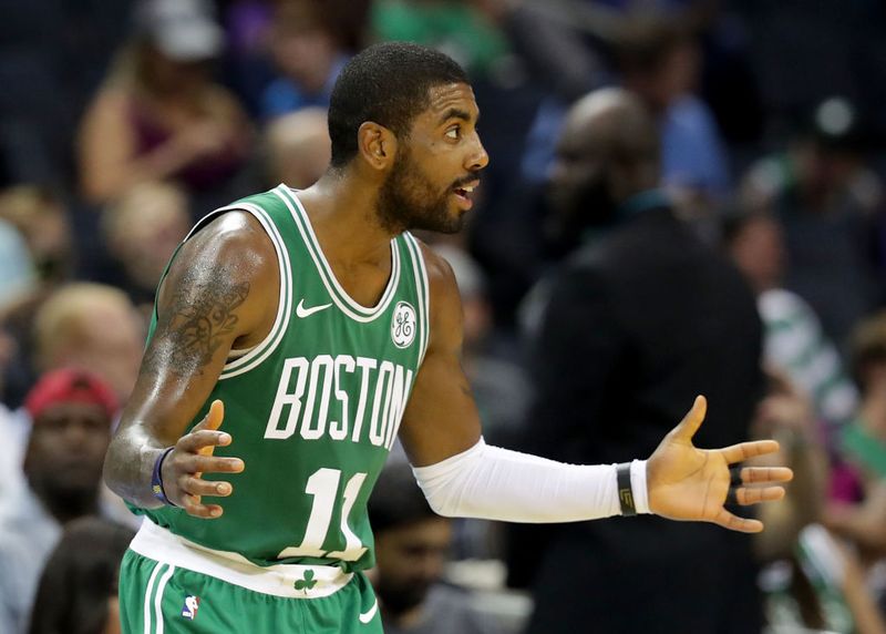 CHARLOTTE, NC - OCTOBER 11:  Kyrie Irving #11 of the Boston Celtics reacts against the Charlotte Hornets during their game at Spectrum Center on October 11, 2017 in Charlotte, North Carolina. NOTE TO USER: User expressly acknowledges and agrees that, by downloading and or using this photograph, User is consenting to the terms and conditions of the Getty Images License Agreement.  (Photo by Streeter Lecka/Getty Images)