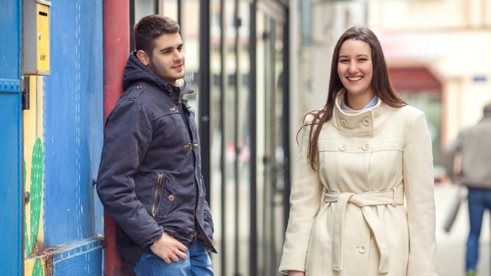 Group of young man flirting with women in city. Friendship, leisure, students lifestyle, first love, communication concept