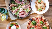 Kota du jour di Kanada pernah berpaling pada pizza dengan dough arang berwarna hitam. Namanya Charcoal pizza, Anda pernah coba? Foto: Istimewa