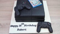 Wah, cake yang satu ini cocok banget buat gamers. Berupa Play Station, lengkap dengan kaset game dan stiknya. Foto: Istimewa