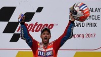 Dua pekan lalu, Dovizioso menang di Malaysia sekaligus menunda pesta juara Marc Marquez. Ini adalah kemenangan keenam musim ini. Dapatkah Dovizioso meraih gelar juara dunia di seri terakhir? (MANAN VATSYAYANA/AFP Photo)