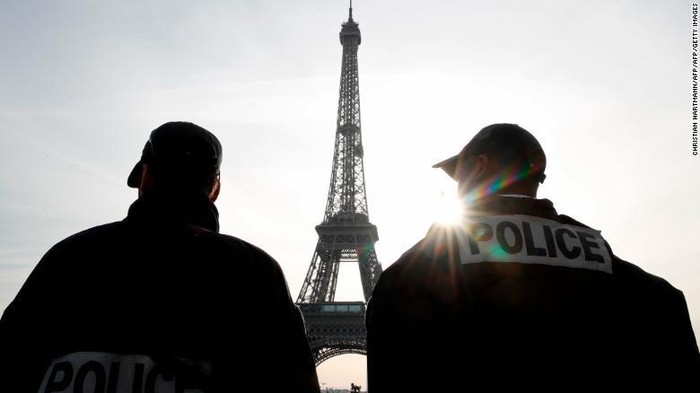 Police patrol in front of the Eiffel Tower in Paris last week as France officially ended a state of emergency. (Christian Hartmann/AFP/Getty Images)