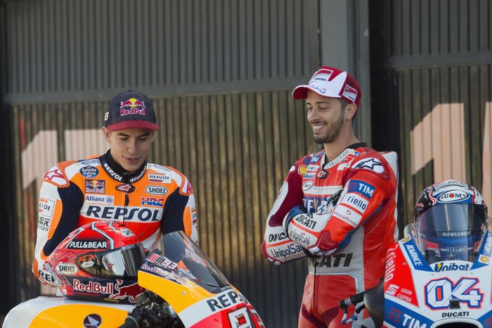 VALENCIA, SPAIN - NOVEMBER 09:  Andrea Dovizioso of Italy and Ducati Team (R) pose with Marc Marquez of Spain and Repsol Honda Team in pit during the photo opportunity between Marc Marquez and Andrea Dovizioso on their bikes during the Comunitat Valenciana Grand Prix - Moto GP Previews at Comunitat Valenciana Ricardo Tormo Circuit on November 9, 2017 in Valencia, Spain.  (Photo by Mirco Lazzari gp/Getty Images)
