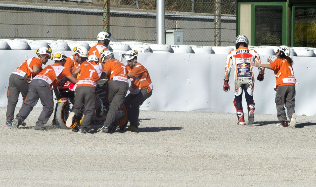 VALENCIA, SPAIN - NOVEMBER 10:  Marc Marquez of Spain and Repsol Honda Team walks out of track after crashed out during the Comunitat Valenciana Grand Prix - Moto GP Previews at Comunitat Valenciana Ricardo Tormo Circuit on November 10, 2017 in Valencia, Spain.  (Photo by Mirco Lazzari gp/Getty Images)