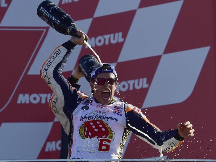 Marc Marquez juara dunia Motogp 2017 (AFP PHOTO / PIERRE-PHILIPPE MARCOU) Marc Marquez juara dunia Motogp 2017 (AFP PHOTO / PIERRE-PHILIPPE MARCOU)