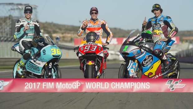VALENCIA, SPAIN - NOVEMBER 12:  (L-R) Joan Mir of Spain and Leopard Racing,  Marc Marquez of Spain and Repsol Honda Team and Franco Morbidelli of Italy and EG 00 Marc VDS (the three 2017 champions) pose on the bikes during the Comunitat Valenciana Grand Prix - Moto GP  at Comunitat Valenciana Ricardo Tormo Circuit on November 12, 2017 in Valencia, Spain.  (Photo by Mirco Lazzari gp/Getty Images)