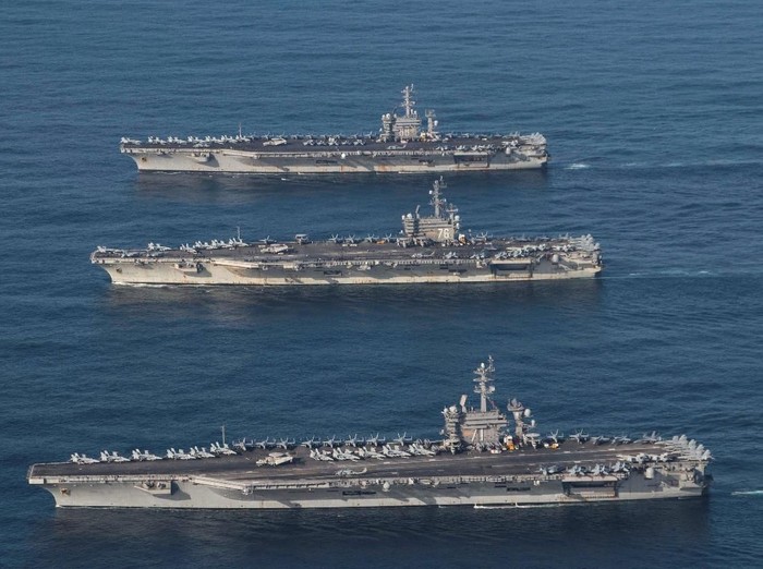 The aircraft carriers USS Ronald Reagan (CVN 76), USS Theodore Roosevelt (CVN 71) and USS Nimitz (CVN 68) are underway, conducting operations, in international waters as part of a three-carrier strike force exercise in western Pacific, November 12, 2017.   Courtesy James Griffin/U.S. Navy/Handout via REUTERS  ATTENTION EDITORS - THIS IMAGE HAS BEEN SUPPLIED BY A THIRD PARTY.