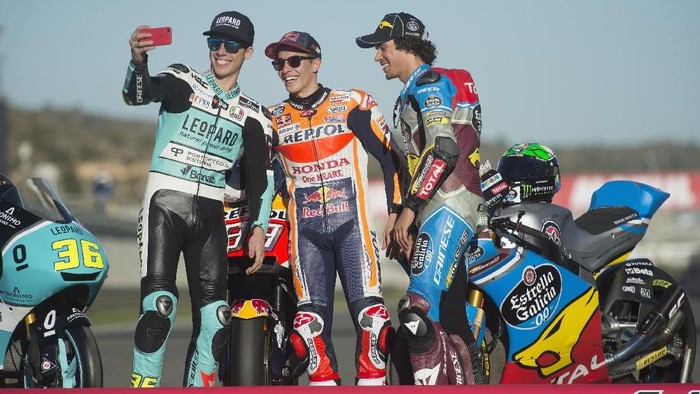 VALENCIA, SPAIN - NOVEMBER 12:  (L-R) Joan Mir of Spain and Leopard Racing,  Marc Marquez of Spain and Repsol Honda Team and Franco Morbidelli of Italy and EG 00 Marc VDS (the three 2017 champions) pose on the bikes during the Comunitat Valenciana Grand Prix - Moto GP  at Comunitat Valenciana Ricardo Tormo Circuit on November 12, 2017 in Valencia, Spain.  (Photo by Mirco Lazzari gp/Getty Images)
