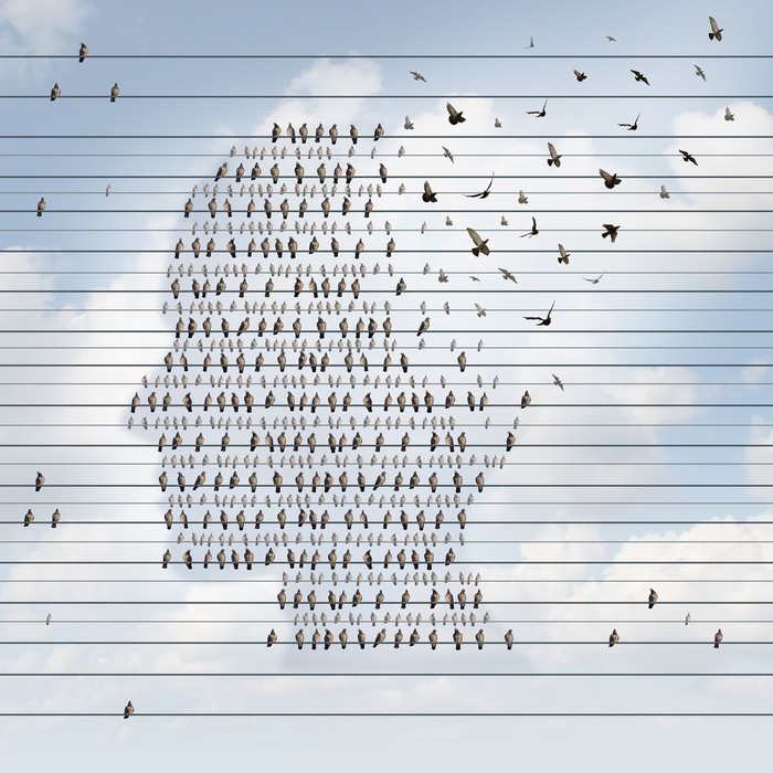 Dementia written in wooden cubes on a table from well ordered to chaotic