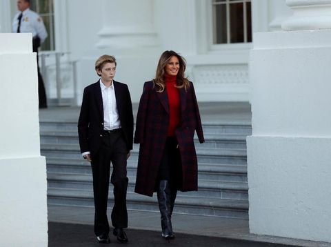 First Lady Melania Trump and her son Barron Trump welcome the official White House Christmas Tree, a Wisconsin-grown tree provided by the Chapman family of Silent Night Evergreens, to the White House in Washington DC, U.S. November 20, 2017.  REUTERS/Carlos Barria