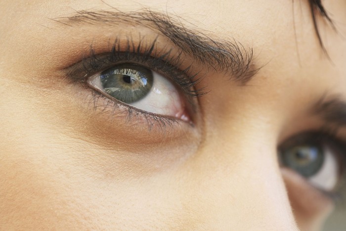 Beautiful blond woman with painted eye
