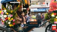 Ia tampak mengenakan jas berwarna cokelat (Foto: Dok. Screenshot CNN Indonesia)