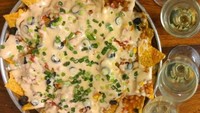 Menu favorit di restoran Tex-Mex. Hidagan khas Meksiko yang terdiri dari keripik tortila yang disirami dengan keju leleh. Mulur renyah! Foto: Istimewa