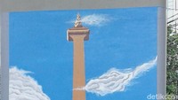 Mural Monas tergambar di salah satu sisi tiang JLNT (Foto: Eva Safitri/detikcom)