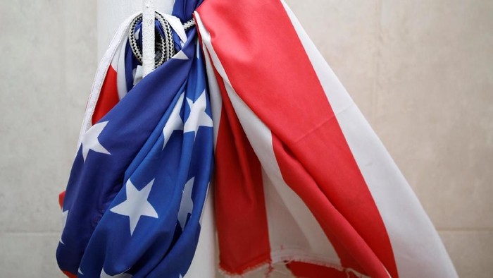 The U.S national flag is seen tied around a flag pole at the U.S. Embassy in Tel Aviv, Israel December 6, 2017. REUTERS/Amir Cohen
