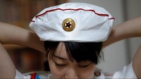 Dalam Bahasa Jepang, fans club ini disebut sebagai Sengun Joshi, atau gadis-gadis militer. Mereka juga gemar dengan budaya dan seni Korea Utara. (Toru Hanai/Reuters)