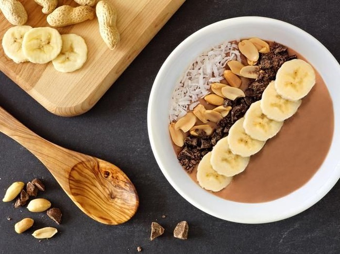 Granola bar and strawberries on plate