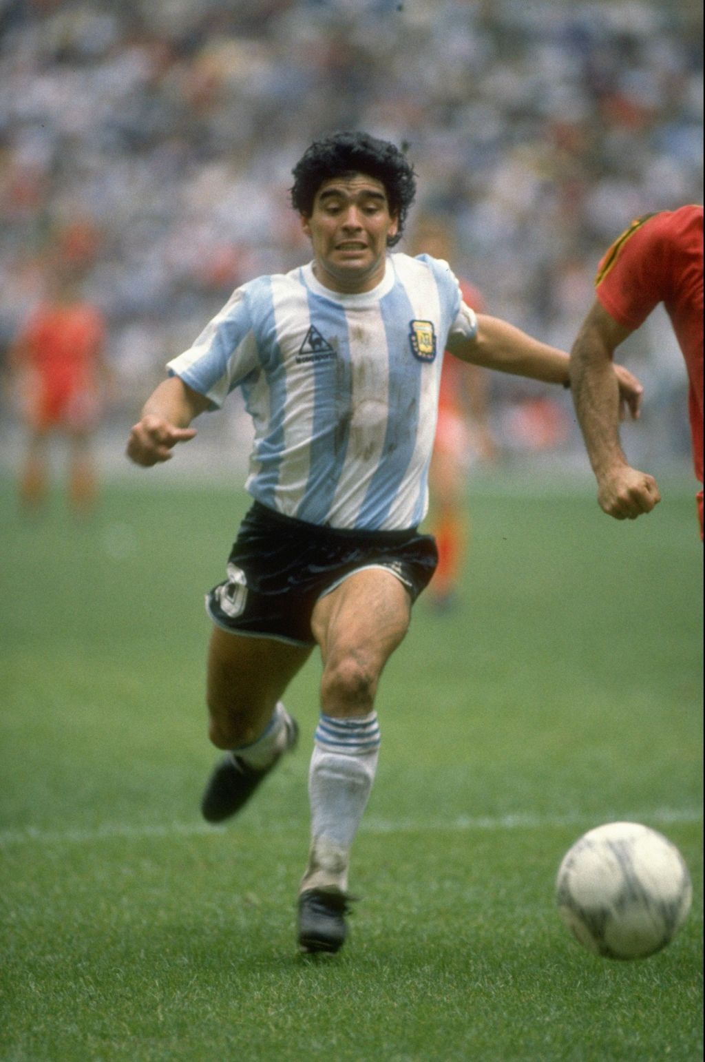 Diego Maradona 25 Jun 1986: Diego Maradona of Argentina in action during the World Cup semi-final against Belgium at the Azteca Stadium in Mexico City. Argentina won the match 2-0. Mandatory Credit: Mike King/Allsport