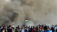 Bentrokan di Gaza ini pecah usai kelompok Hamas yang menguasai wilayah itu, menyerukan aksi yang disebut hari kemarahan untuk memprotes keputusan AS mengakui Yerusalem sebagai ibu kota Israel. Foto: AFP PHOTO/MOHAMMED ABED