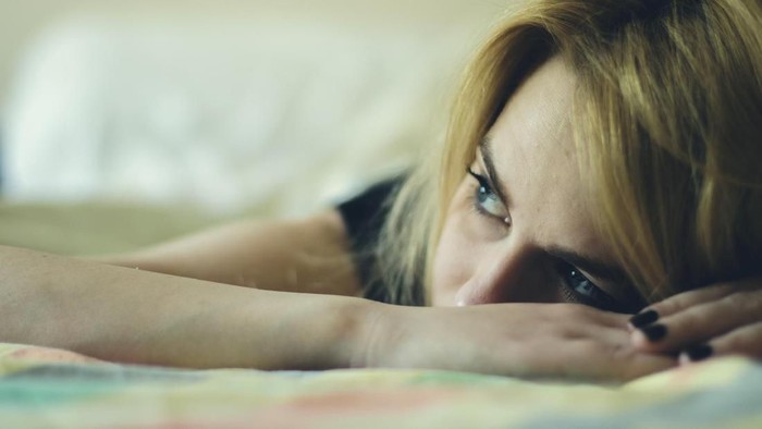 885350192 Girl looks at her smartphone