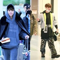 Gaya busana Jonghyun di bandara pun tak kalah edgy. Seperti hoodie yang ia padankan dengan jaket, atau oversized T-shirt dipadukan celana army. Foto: istimewa