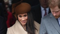 Meghan Markle mengenakan coat berwarna krem yang dipadukan dengan topi coklat. (Foto: Chris Jackson/Getty Images)