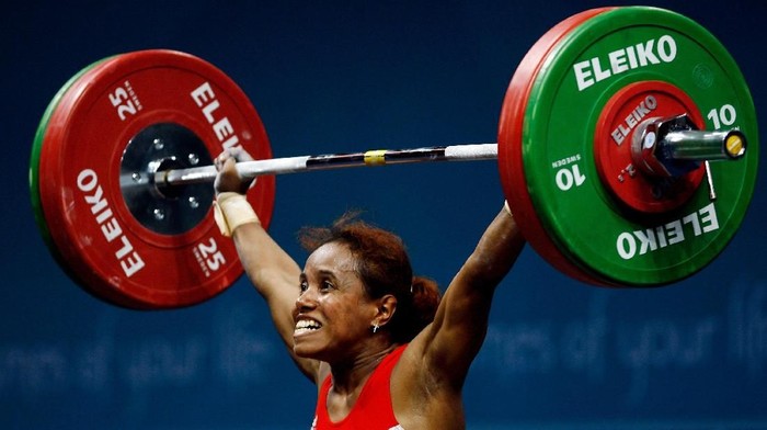 DOHA, QATAR - DECEMBER 02:  Raema Lisa Rumbewas of India attempts a lift in the Womens 53kg Group A weightlifting at the 15th Asian Games Doha 2006 at Al-Dana Banquet Hall on December 2, 2006 in Doha, Qatar.  (Photo by Ian Walton/Getty Images for DAGOC)